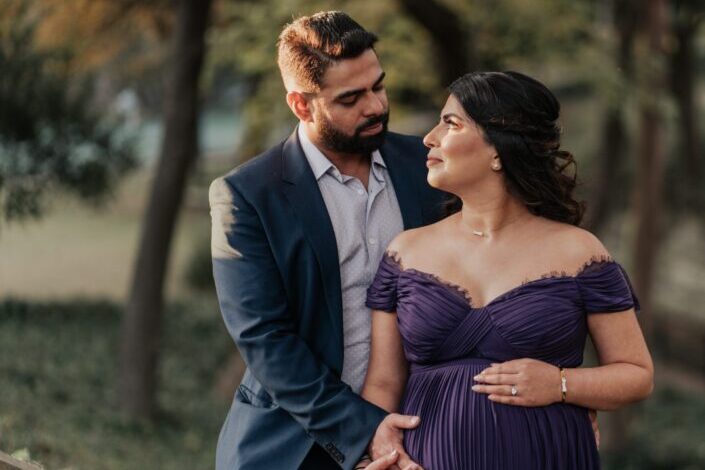 Pregnant couple wearing a formal attire
