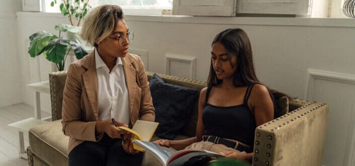 Professor and student having research discussion