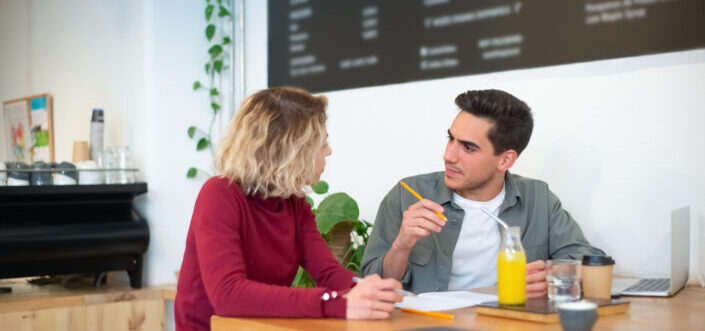 woman talking to her colleague