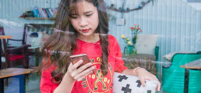 Young lady looking at her phone 