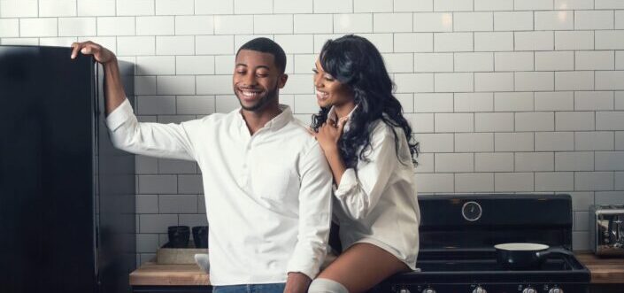 Couple being cozy in the kitchen.