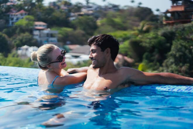 Couple enjoying the pool - sexy questions to ask your boyfriend