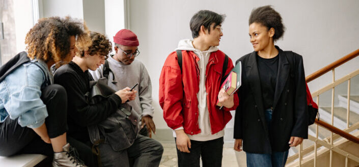 Students hanging out by a staircase