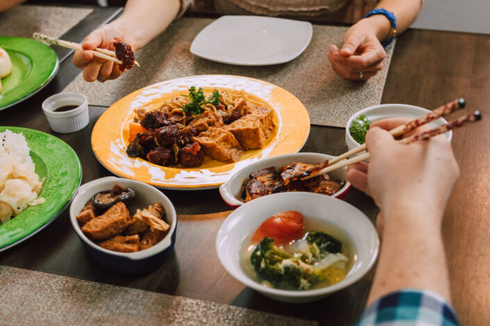 person eating asian cuisine