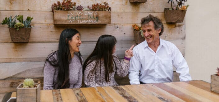 A Happy Family Laughing Together