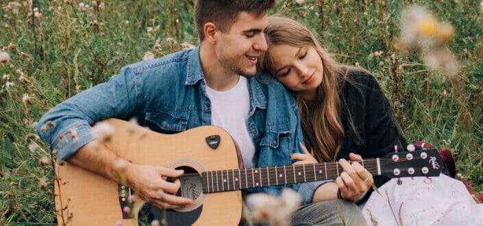 Man playing a song to his woman