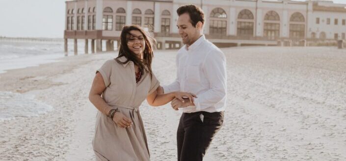 man holding his cheerful girl carefully