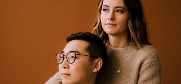 A man and woman looking at something