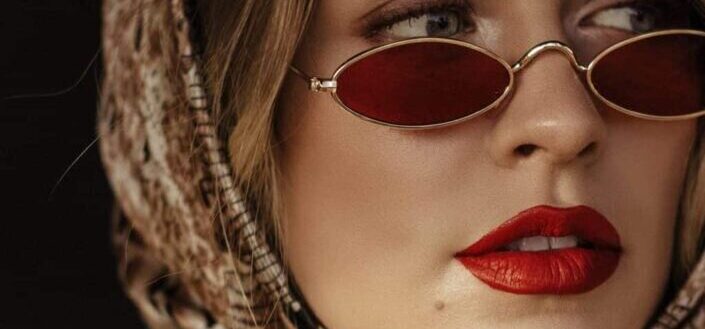 Woman with beautiful glasses and red lipstick