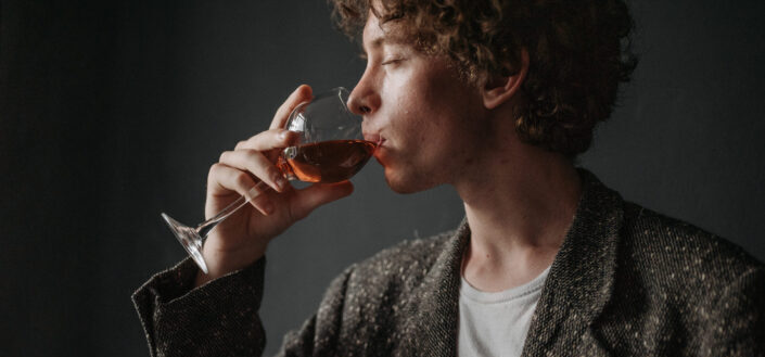 Guy sipping on some wine