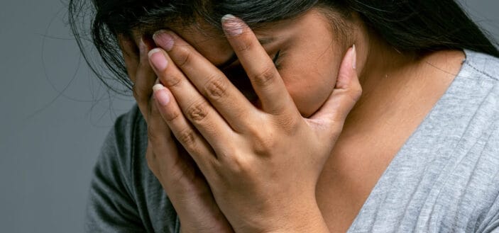 Woman sobbing