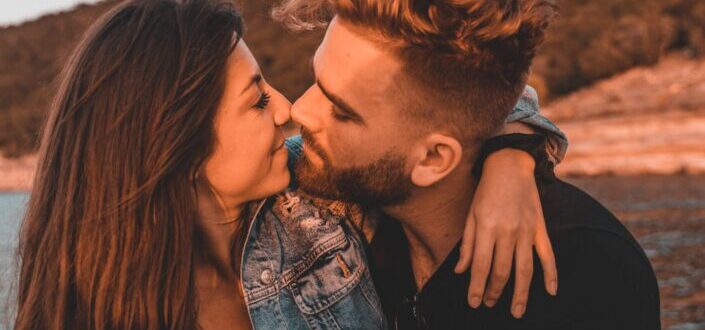 Man kissing a womans cheek