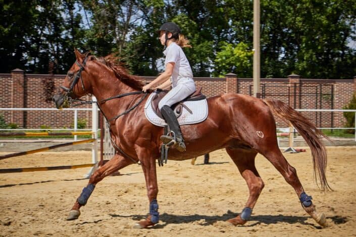 young woman riding horse