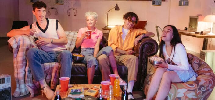 Group of Friends Sitting on the Living Room