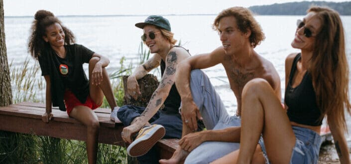 Happy Friends Sitting on a Wooden Bench
