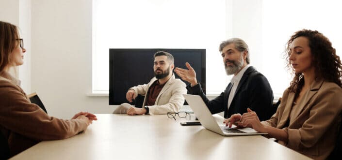 People brainstorming in a conference.