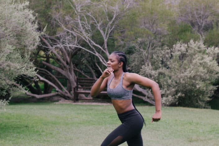 Woman Wearing Grey Sports Bra running