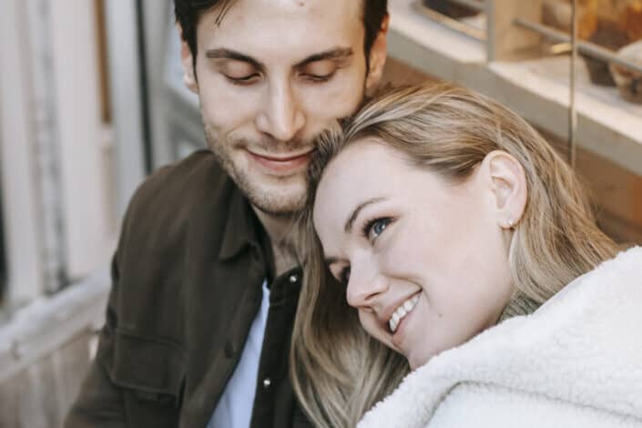 Woman with her head on her partner's shoulder