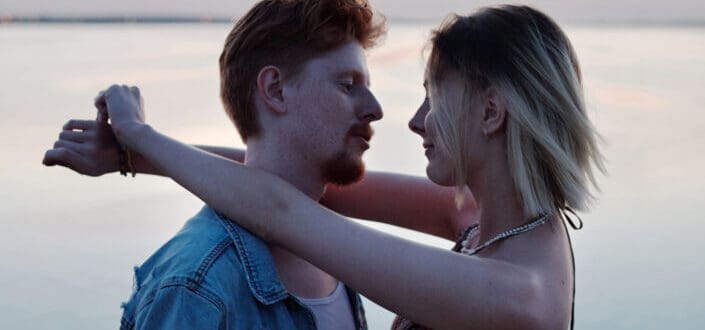 Woman and man about to kiss