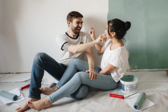 Couple taking a break from wall-painting.