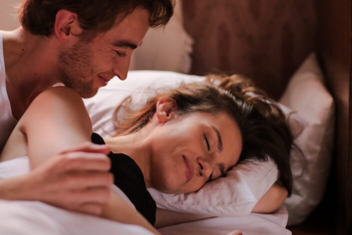 Man Waking A Woman Up
