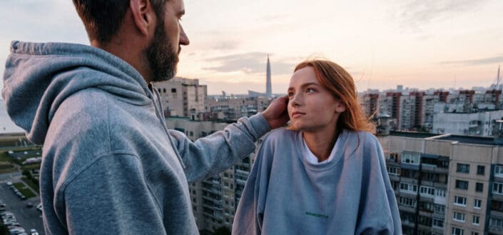 Guy caressing her girlfriend's hair 