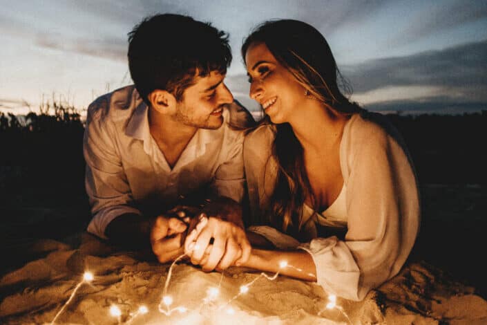 Couple Smiling While Holding Hands