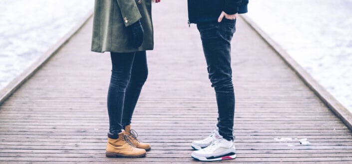 Man And Woman Standing On A Baywalk