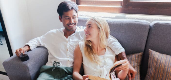 Couple Looking at Each Other at The Couch