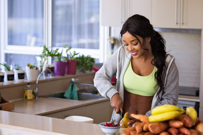Woman Slicing a Fruit