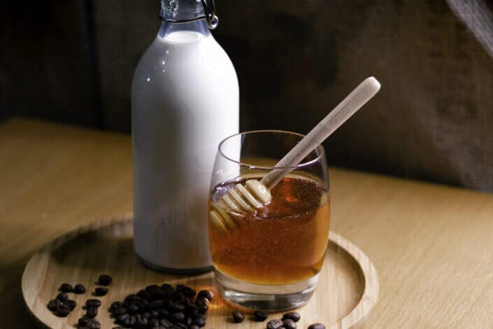 Milk And Honey On Wooden Tray