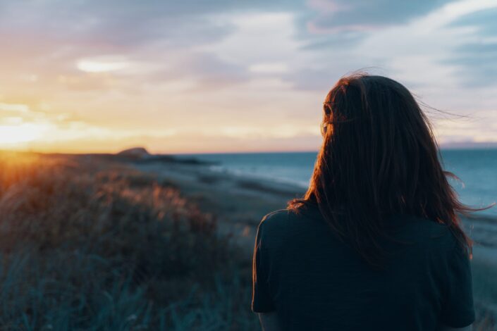 A lady watching the sunset