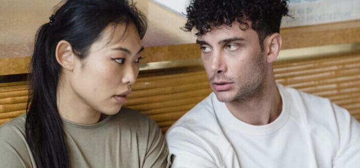 A Couple Sitting While Having Conversation