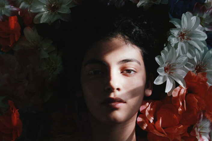 Woman lying on flowers