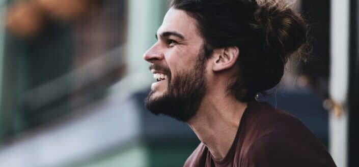 Man in Maroon Shirt Laughing