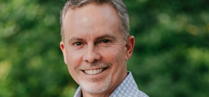 Smiling Man Wearing a Dress Shirt
