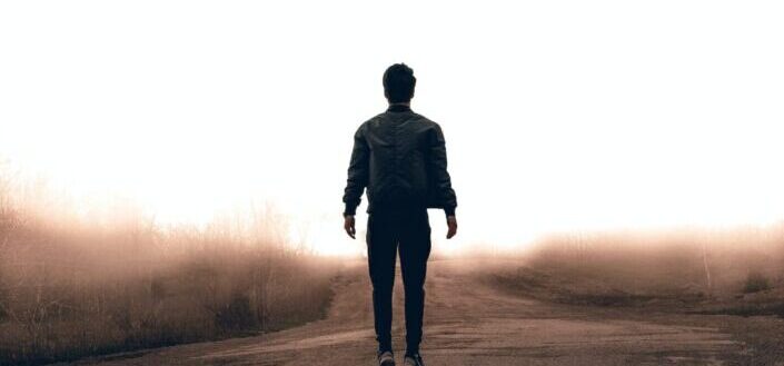 Man Walking Along the Road