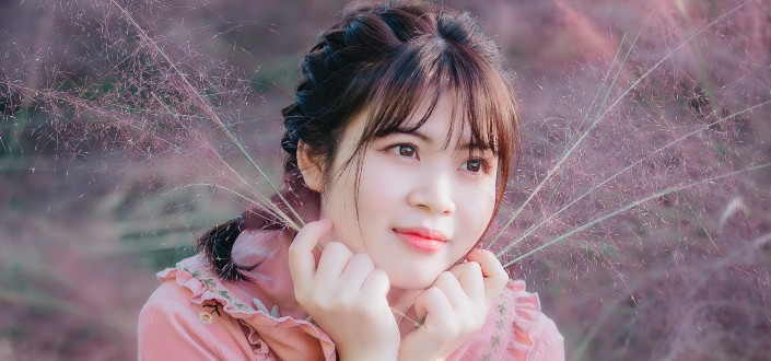 Woman With Braided Hair and Fringe Bangs