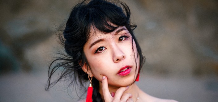 Woman Wearing Red Tassel Earrings