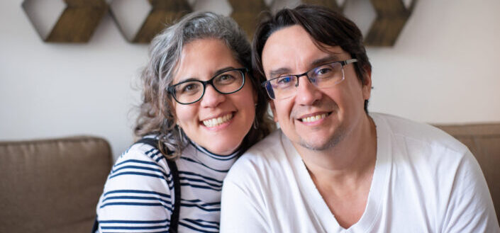 A man and a woman smiling