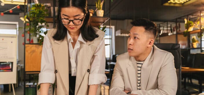 A man and woman having a meeting in the office