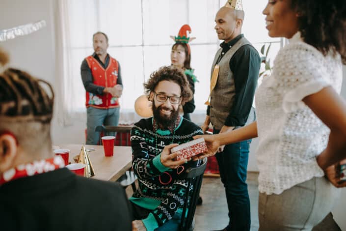 Woman Giving a Gift to a Man