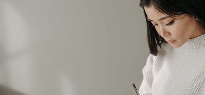close-up-photography-of-a-woman-writing-on-notebook-stockpack-pexels