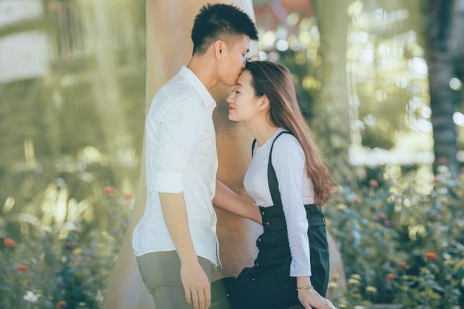 Man Kissing Woman in Black Dress - How to Respond to I Love You