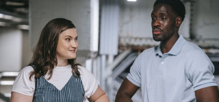 man-in-blue-polo-shirt-talking-to-a-woman-stockpack-pexels