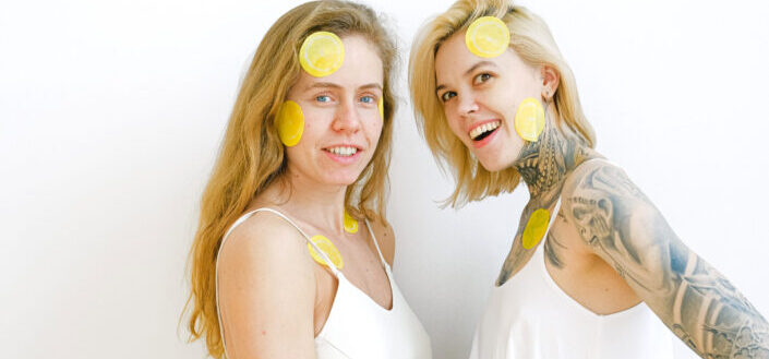 Positive women having skincare procedure in studio