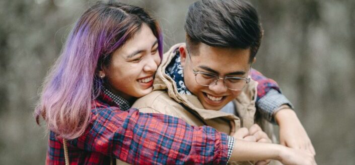 Woman hugging man from behind