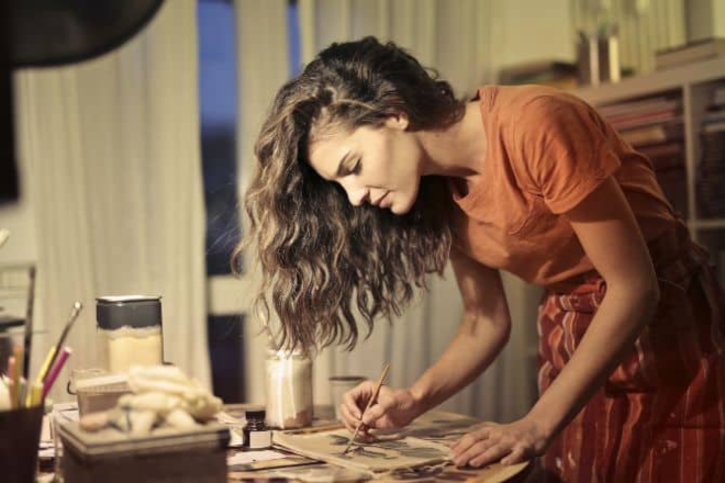 Hobbies for women in their 20's - Woman sketching while standing- Main Hobbies-For-Women-In-Their-20s-Top-1