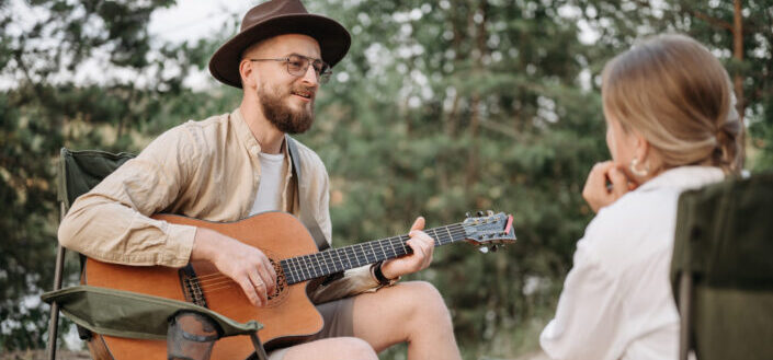 Man Playing His Guitar For a Woman