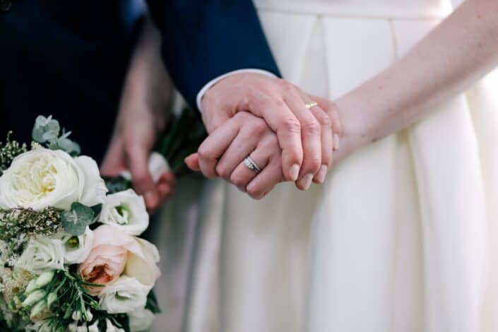 Bride and Groom Holding Hands